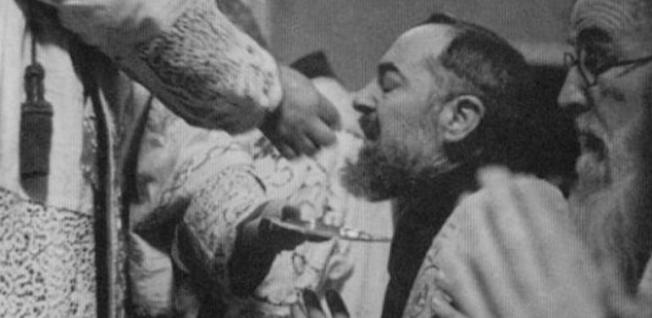 Padre pio receiving communion